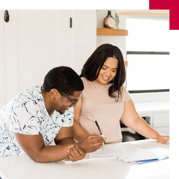 new tenant signing lease in apartment kitchen